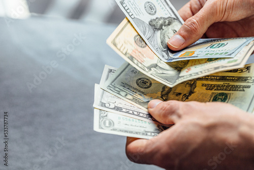 hand holding 100 dollar bank notes detail for business and financial use, news, article, blog