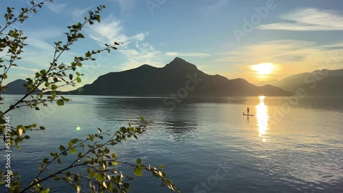 Porteau Cove Provincial Park Canada Vancouver beautiful nature Pacific ocean and mountains returning and reflected in the water Lonely man canoeing in the middle of the river photo