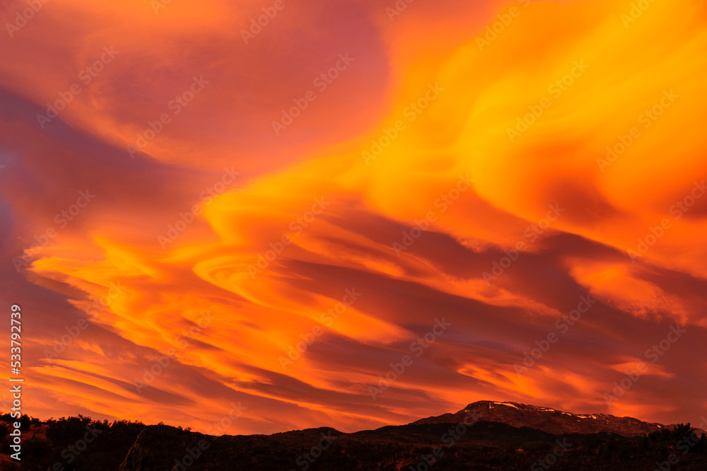 Chile, Aysen. Lenticular clouds at sunset.