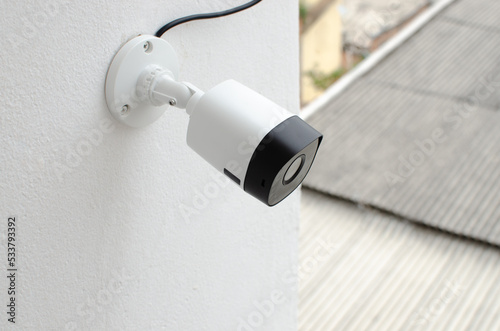 Video Camera CCTV, CFTV security camera, white wall camera, safely recording the external environment in a busy place. Safe circuit, theft protection. Surveillance view.