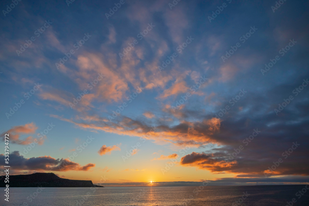 Sunset over Pacific Ocean, Santiago Island, Galapagos Islands, Ecuador.