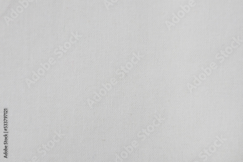 Snow white cotton cloth background. Surface of fabric texture in white winter color.