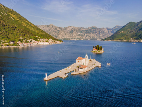 Picturesque island st. George and temple Gospa od Skrpela. Drone view. Boka Kotor Bay, Perast, Montenegro. Ancient Church Crkva Gospa od Skrpjela. Amazing mountain landscape. Beautiful gulf Kotor photo