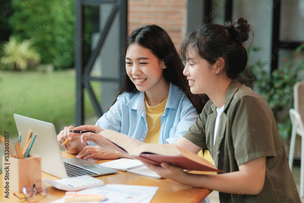 Young asian students campus helps friend catching up and learning. Young asian students campus helps friend catching up and learning.