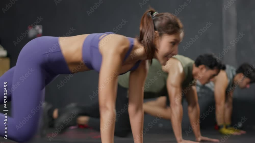 Group of young athlete male and female exercising together in fitness. Group of young athlete male and female exercising together in fitness.