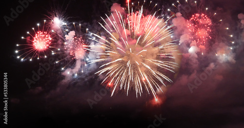 Colorful vibrant Firework celebrate anniversary happy new year 2023  4th of july holiday festival. colorful firework in the night time to celebrate national holiday. countdown new year 2023 party time