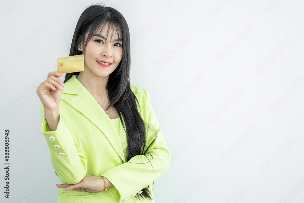Beautiful Asian woman holding credit card on white background, Asian woman smiling showing presenting credit card, Woman holding bank business credit card, copy space. Beautiful Asian woman holding credit card on white background, Asian woman smiling showing presenting credit card, Woman holding bank business credit card, copy space.