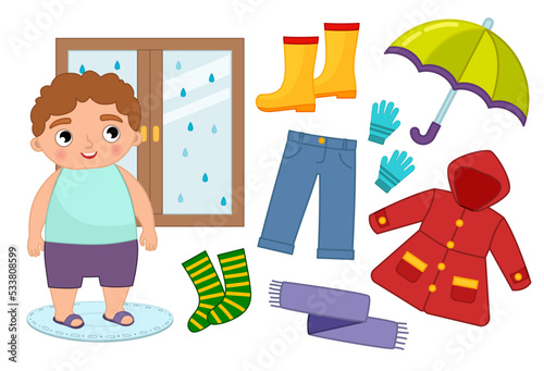 Vector set of seasonal autumn clothes for kids. Illustration of a cartoon boy looking out the window.
