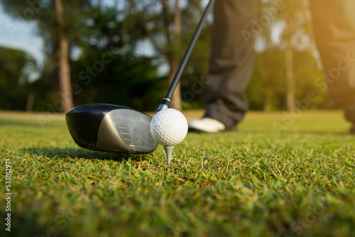 golfer prepare tee off on golf course for driver a ball into the hole