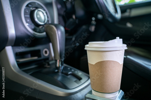 paper coffee cup in the car, traveler's hot coffee