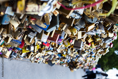 Bridge full of locks in Paris france, love tourism, couples symbol