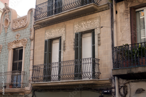 wide photo of European balconies and windows architecture