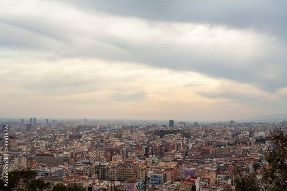 cityscape of barcelona with sunset cloud sky