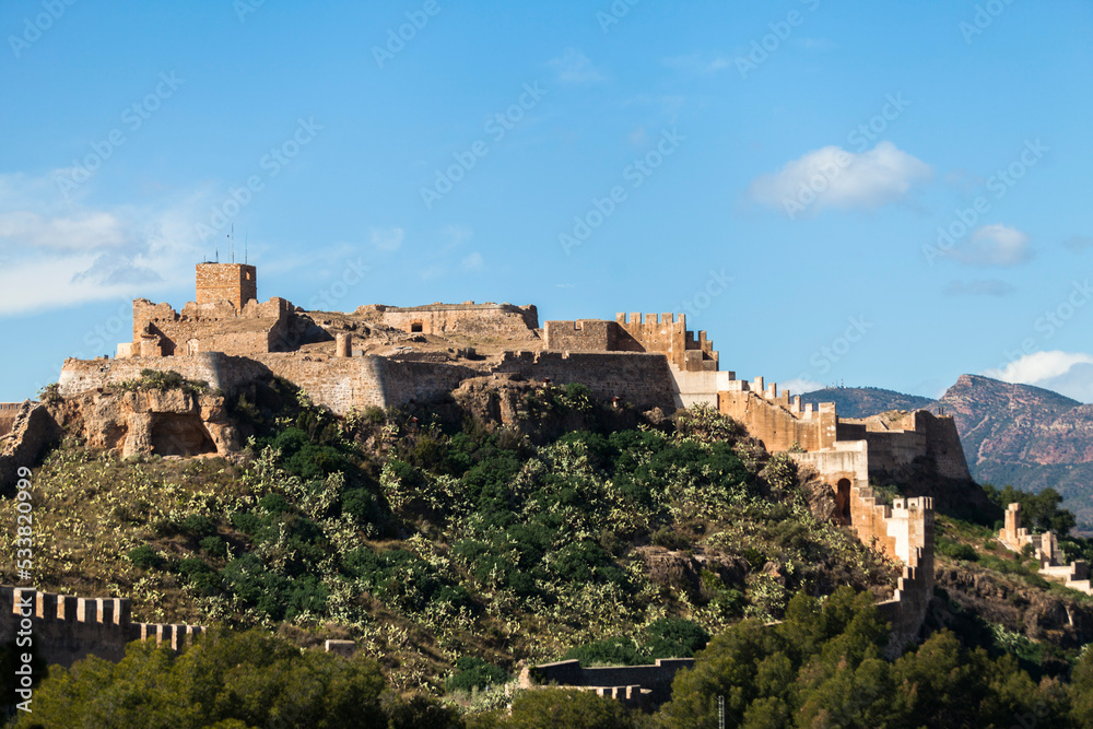 Fototapeta premium castle of sagunt in spain with port city and ocean background