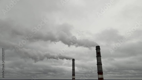 Atmospheric pollution,harmful emissions and global warming,ecological problem.Smoky chimneys of the power plant aerial view.Electric power generation,power plant for burning coal.Thick smoke from fuel
