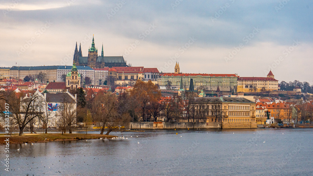Beautiful view of Prague and Prague Castle along Vltava River . Historic and romantic old town during winter . Prague , Czech  : December 12 , 2019