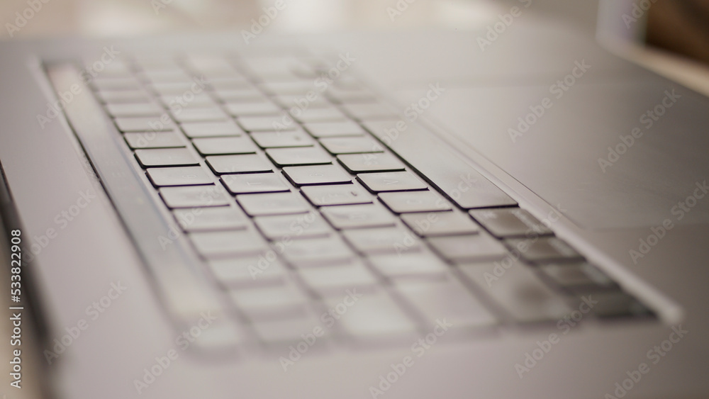 Close up macro of laptop keyboard mac computer backlit Close up macro of laptop keyboard mac computer backlit