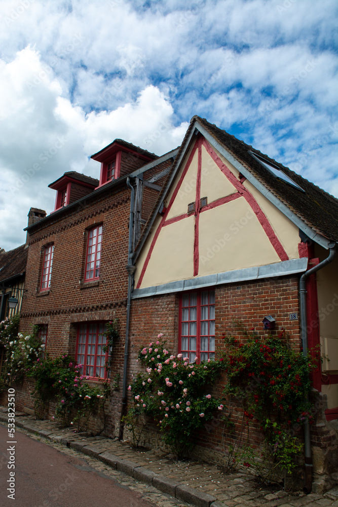 One of most beautiful french villages, Gerberoy - small historical village with half-timbered houses and colorful roses flowers, France One of most beautiful french villages, Gerberoy - small historical village with half-timbered houses and colorful roses flowers, France