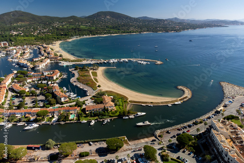 Aerial view on Gulf of Saint-Tropez, sail boats, houses of Port Grimaud and Port Cogolin, summer vacation in Provence, France photo