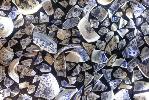 broken bowls and plates on the ground	