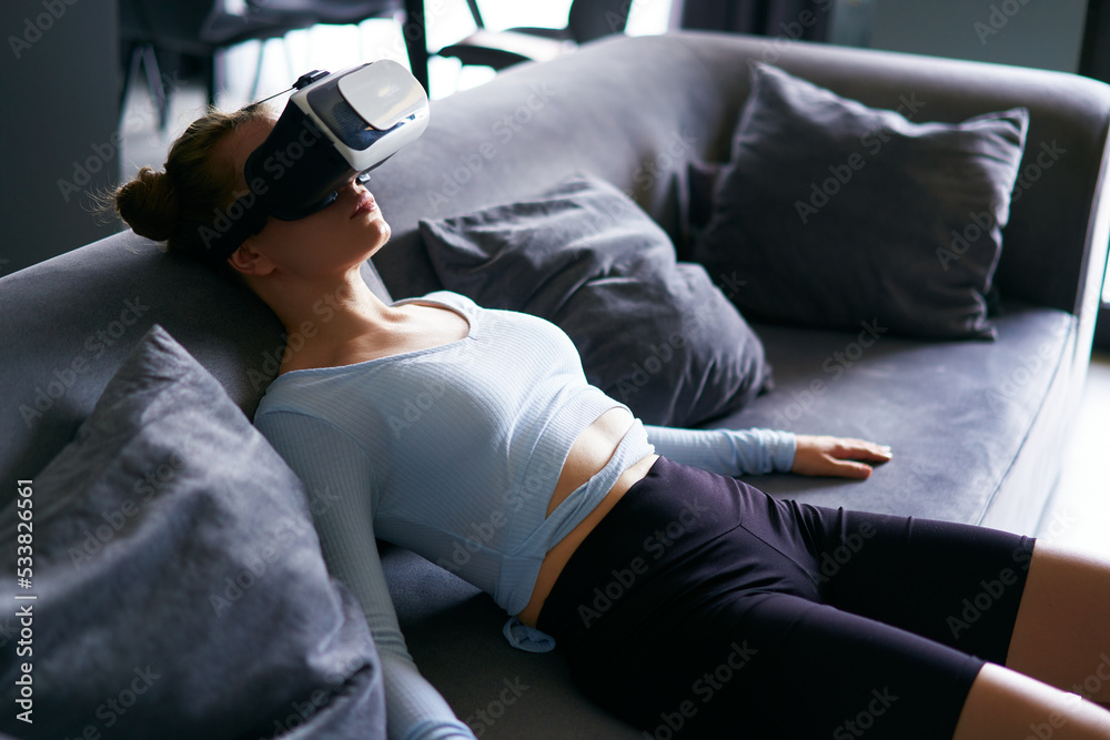 Robot like futuristic doll woman in virtual reality goggles interface