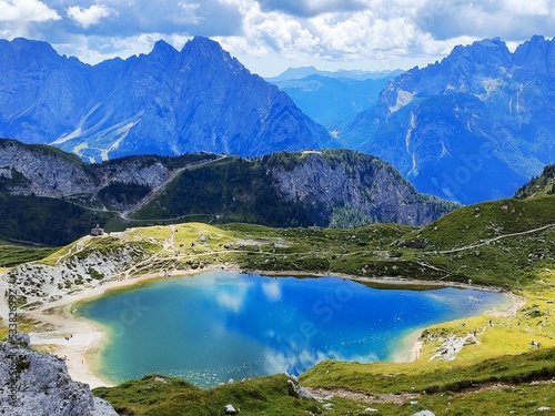 Fototapeta Naklejka Na Ścianę i Meble -  The shades of colours of Lake Olbe on a cloudy day in Sappada on the mountains of Dolomites, Italy