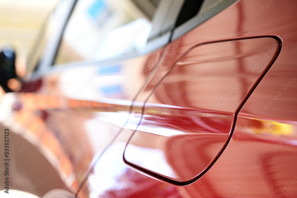 gas tank of glossy red car, transportation industry gas tank of glossy red car, transportation industry