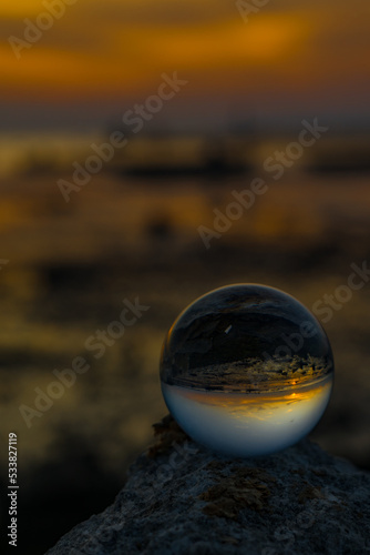 The reflection on crystal ball during sunset