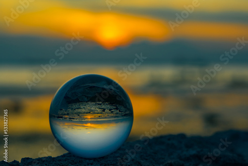 The reflection on crystal ball during sunset