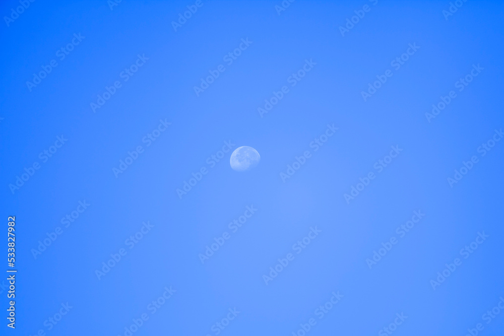 daylight moon cloudless blue sky