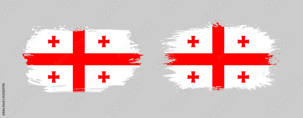 Set of two grunge brush flag of Georgia on solid background