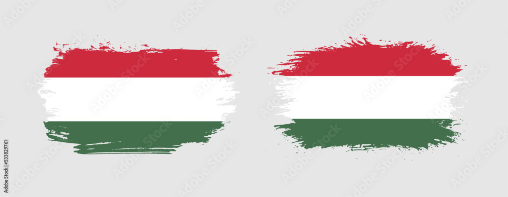 Fototapeta premium Set of two grunge brush flag of Hungary on solid background