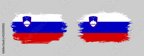 Set of two grunge brush flag of Slovenia on solid background