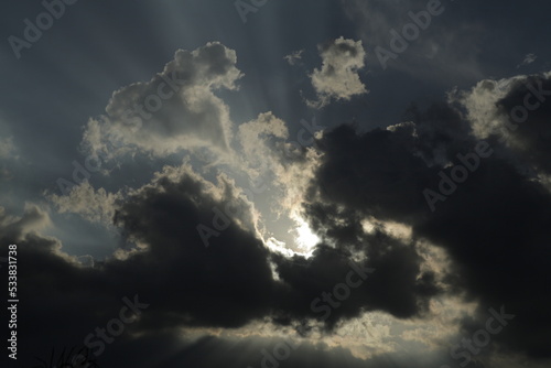 telephoto shot of backlit clouds in the sky texture background