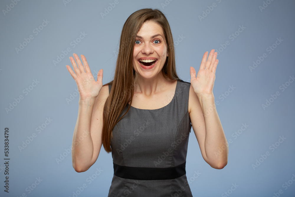 Surprising business woman in gray dress. isolated portrait of excited young woman.