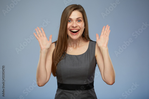 Surprising business woman in gray dress. isolated portrait of excited young woman.