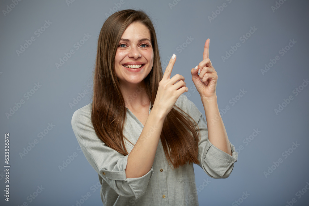 Smiling business woman pointing finger up. isolated portrait. Smiling business woman pointing finger up. isolated portrait.