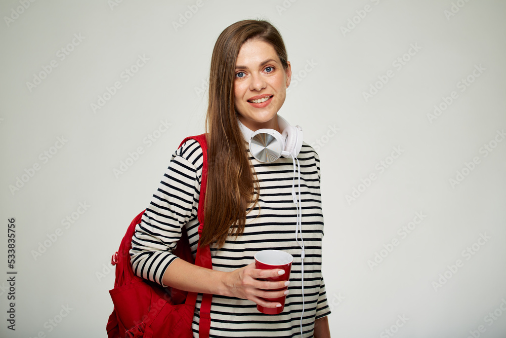 Adult student with coffee cup. Modern woman isolated portrait in teenager style on white background. Adult student with coffee cup. Modern woman isolated portrait in teenager style on white background.