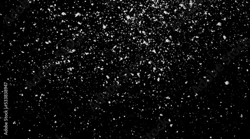 Falling snow isolated on black background Overlay texture Snowstorm