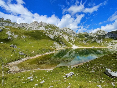 Lake Olbe on a cloudy day in Sappada on the mountains of Dolomites, Italy photo