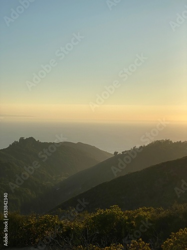 sunset at the pazfic ocean with mountains 