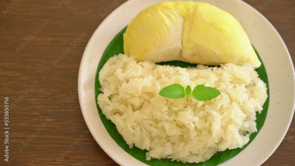 Durian with sticky rice - sweet durian peel with yellow bean, Ripe durian rice cooked with coconut milk - Asian Thai dessert summer tropical fruit food Durian with sticky rice - sweet durian peel with yellow bean, Ripe durian rice cooked with coconut milk - Asian Thai dessert summer tropical fruit food