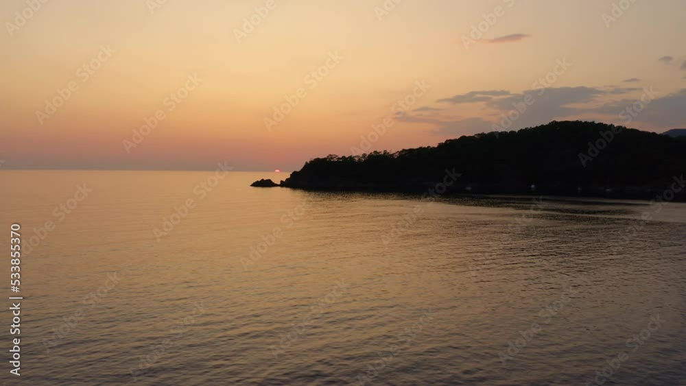 Seaside of evening landscape. Beautiful mountains and sea under sunset sky. Panoramic view from drone. Seaside of evening landscape. Beautiful mountains and sea under sunset sky. Panoramic view from drone.