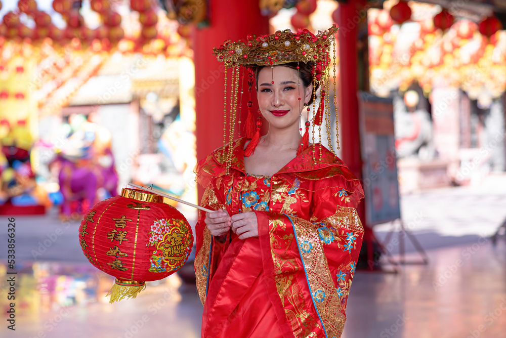 Portrait asian woman wearing traditional Chinese dress cheongsam for Chinese New Year
