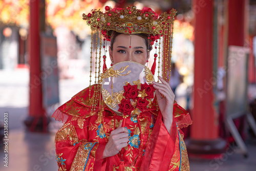 Portrait asian woman wearing traditional Chinese dress cheongsam for Chinese New Year