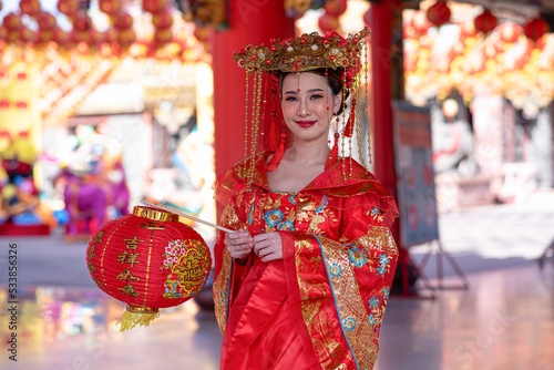Portrait asian woman wearing traditional Chinese dress cheongsam for Chinese New Year