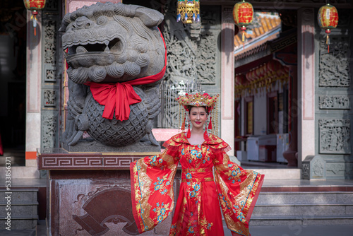 Portrait asian woman wearing traditional Chinese dress cheongsam for Chinese New Year