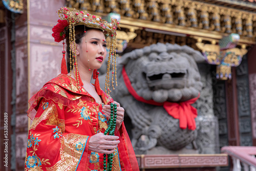 Portrait asian woman wearing traditional Chinese dress cheongsam for Chinese New Year