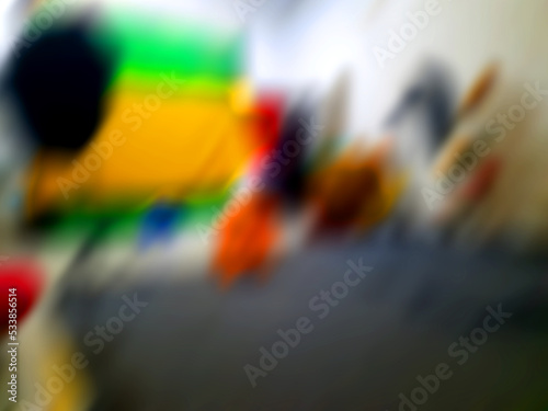 Abstract blurred background with some bright colors in it like yellow, green, and orange.