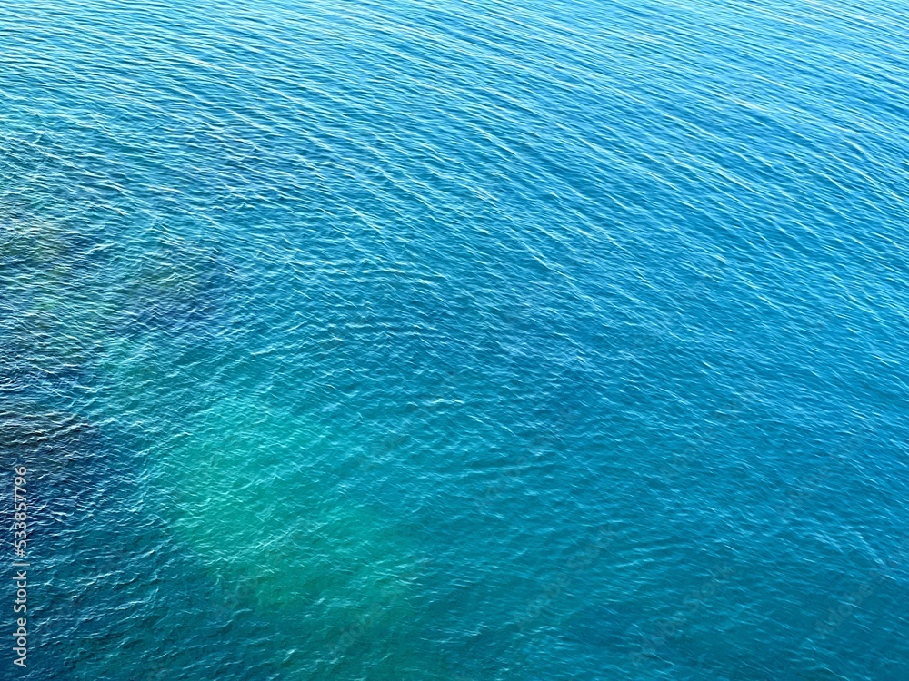 Obraz premium Blue water rippled surface aerial view